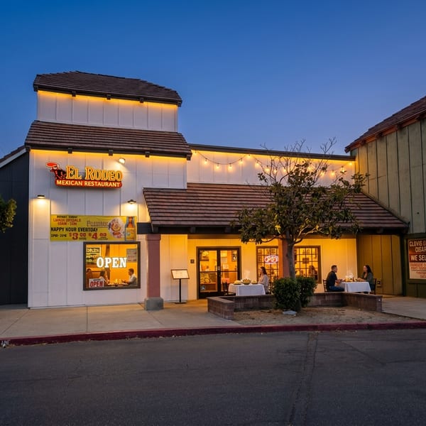 El Rodeo exterior at dusk with warm lights